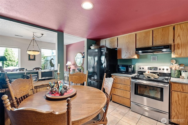 1123 N Whitman, Tacoma, WA 98406 - kitchen with under cabinet range hood, light countertops, black appliances, a textured ceiling, and light tile patterned flooring