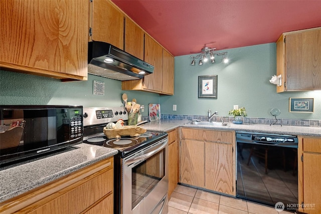 1123 N Whitman, Tacoma, WA 98406 - kitchen featuring light tile patterned floors, under cabinet range hood, black appliances, a textured wall, and a sink
