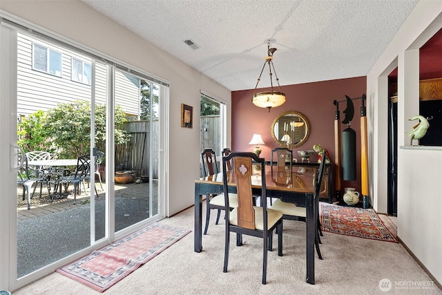 1123 N Whitman, Tacoma, WA 98406 - dining room featuring a textured ceiling, visible vents, and light carpet