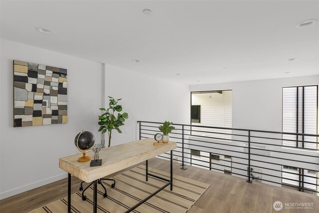 office area with wood finished floors, baseboards, and recessed lighting