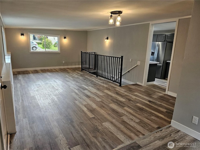16738 2nd Ave NE, Shoreline, WA 98155 - empty room with dark wood-type flooring, crown molding, and baseboards