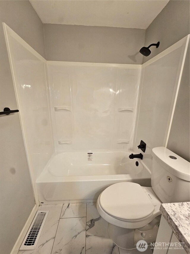 16738 2nd Ave NE, Shoreline, WA 98155 - full bath featuring toilet, marble finish floors, tub / shower combination, and vanity