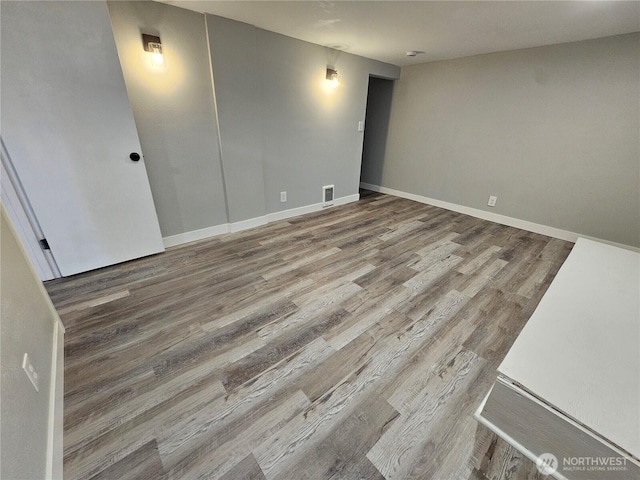 16738 2nd Ave NE, Shoreline, WA 98155 - empty room featuring wood finished floors and baseboards