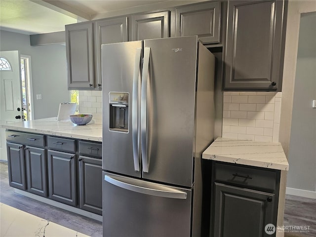 16738 2nd Ave NE, Shoreline, WA 98155 - kitchen with stainless steel fridge with ice dispenser, tasteful backsplash, gray cabinets, and light stone countertops