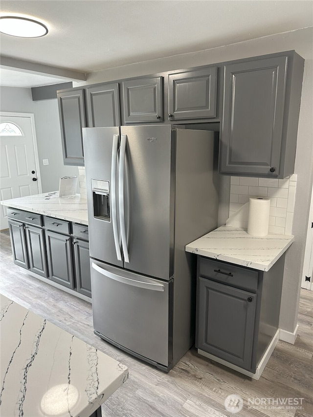 16738 2nd Ave NE, Shoreline, WA 98155 - kitchen featuring stainless steel refrigerator with ice dispenser, gray cabinets, and light wood-style flooring