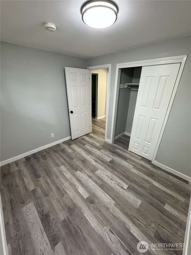 16738 2nd Ave NE, Shoreline, WA 98155 - unfurnished bedroom with wood finished floors and a closet