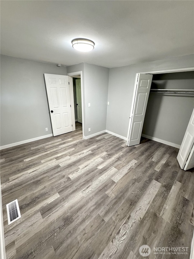 16738 2nd Ave NE, Shoreline, WA 98155 - unfurnished bedroom with wood finished floors and a closet