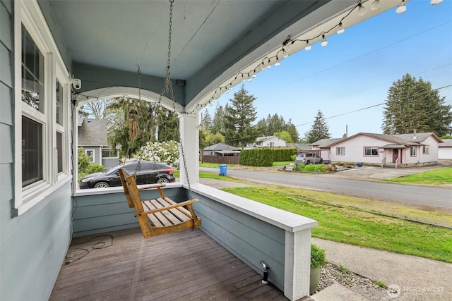 view of patio / terrace featuring covered porch and a residential view