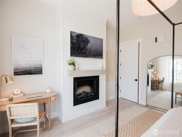 204 Market St Unit A, Pacific Beach, WA 98571 - living room with visible vents, wood finished floors, and a large fireplace