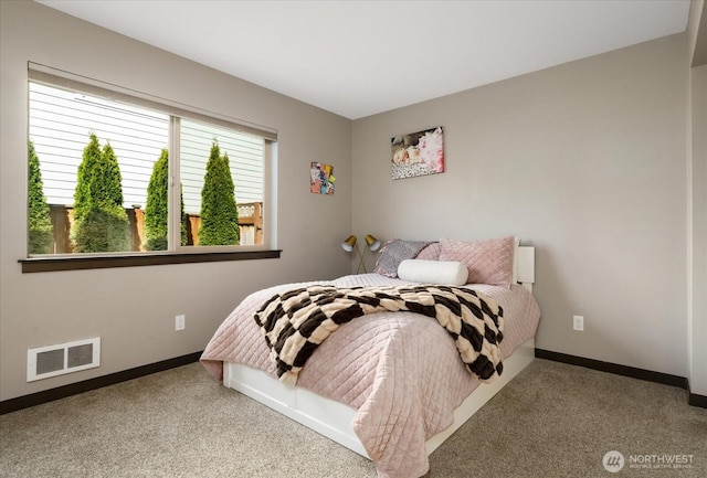 bedroom featuring carpet, visible vents, and baseboards