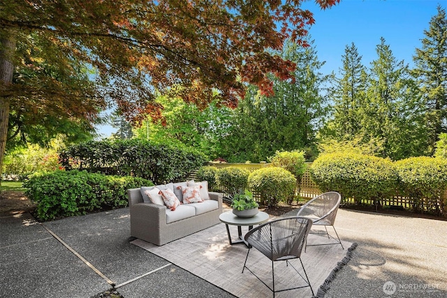 view of patio / terrace featuring fence and outdoor lounge area