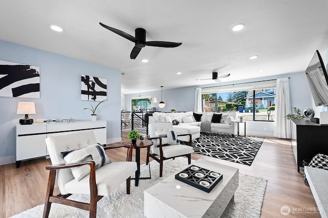 living room with baseboards, recessed lighting, and ceiling fan