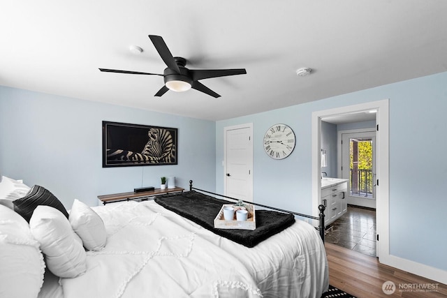bedroom featuring a ceiling fan, baseboards, and dark wood-type flooring