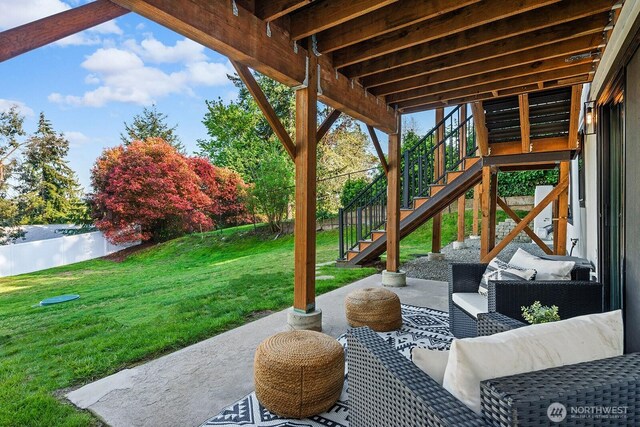 view of patio with stairway and an outdoor living space