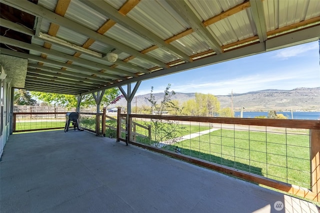 view of patio / terrace featuring a mountain view and a grill