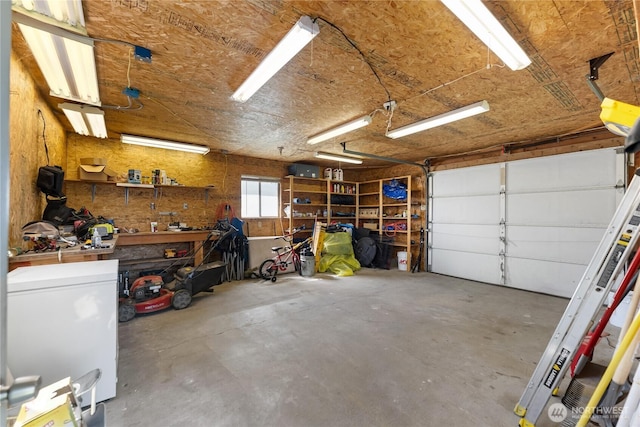 garage with a workshop area