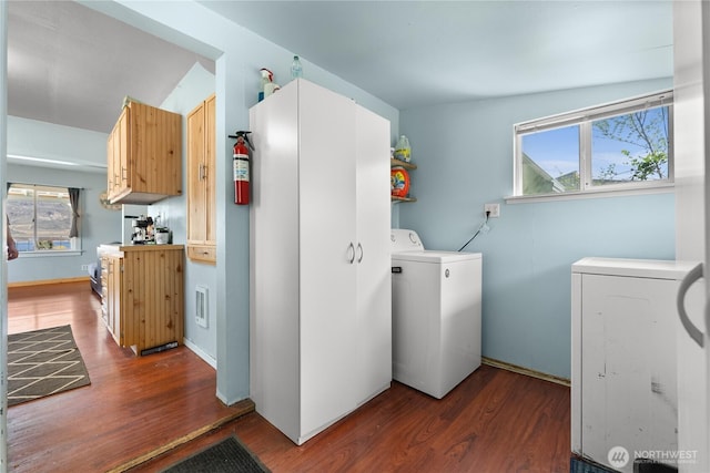 washroom featuring wood finished floors and independent washer and dryer