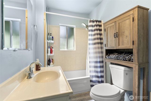 full bathroom with shower / tub combo with curtain, toilet, and vanity