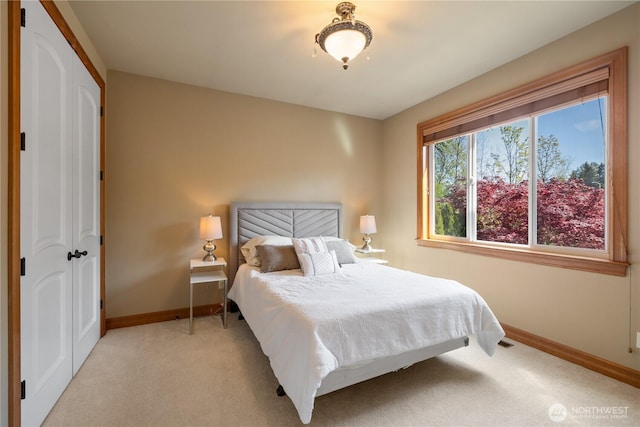 8131 116th Ave NE, Kirkland, WA 98033 - bedroom with baseboards and light carpet