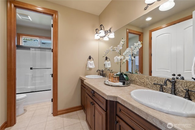 8131 116th Ave NE, Kirkland, WA 98033 - bathroom with a sink, baseboards, tile patterned flooring, and double vanity