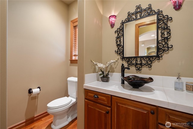 8131 116th Ave NE, Kirkland, WA 98033 - bathroom featuring vanity, wood finished floors, and toilet