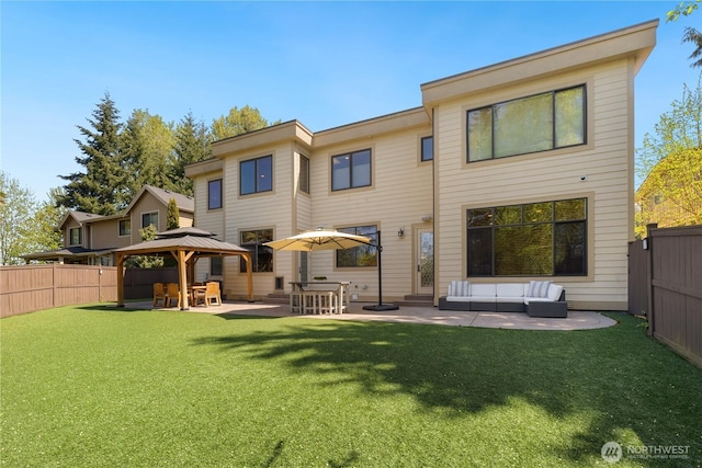 8131 116th Ave NE, Kirkland, WA 98033 - rear view of house featuring a fenced backyard, an outdoor hangout area, a patio area, a gazebo, and a yard