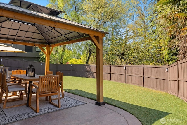 8131 116th Ave NE, Kirkland, WA 98033 - view of patio featuring a fenced backyard, outdoor dining space, and a gazebo