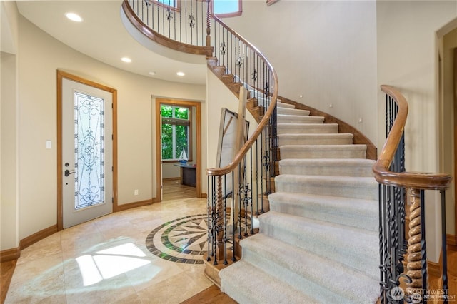 8131 116th Ave NE, Kirkland, WA 98033 - foyer entrance with baseboards, recessed lighting, stairs, and a towering ceiling