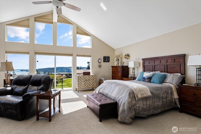 bedroom with high vaulted ceiling, light carpet, and access to exterior