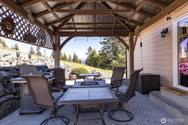 view of patio / terrace featuring a gazebo and an outdoor fire pit