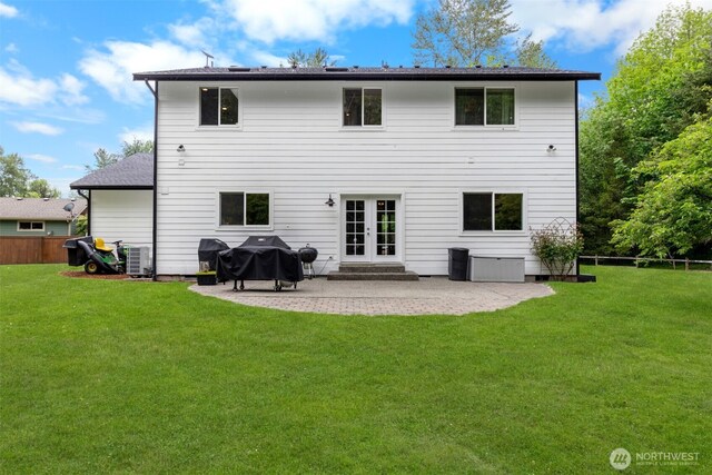 8203 32nd Ave E, Tacoma, WA 98443 - back of house with french doors, a patio area, and central AC
