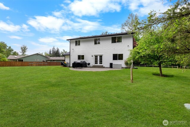 8203 32nd Ave E, Tacoma, WA 98443 - back of house featuring a patio area and french doors