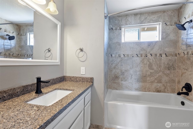 full bath with vanity and shower / washtub combination
