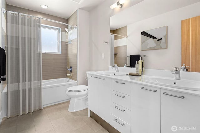 bathroom featuring tile patterned flooring, double vanity, toilet, a sink, and shower / tub combo with curtain