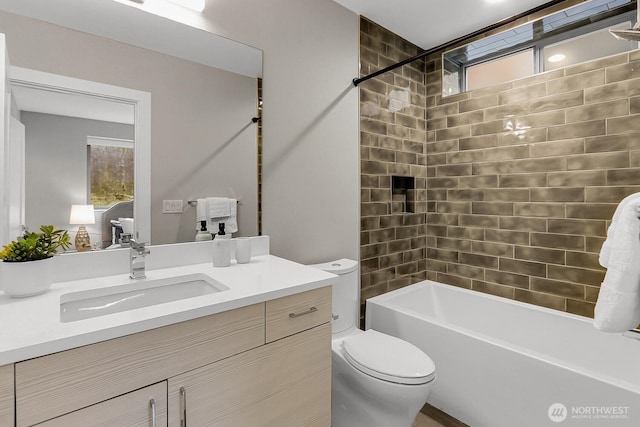 full bathroom featuring toilet, vanity, and shower / washtub combination