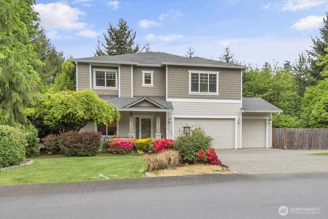 19017 5th St E, Lake Tapps, WA 98391 - view of front of house with asphalt driveway, an attached garage, covered porch, and a garage