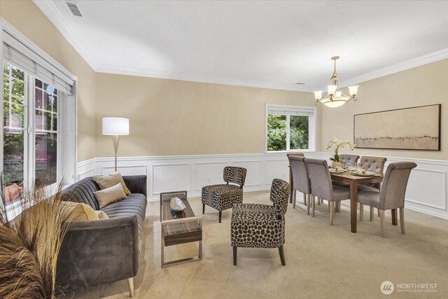 19017 5th St E, Lake Tapps, WA 98391 - sitting room with a chandelier, crown molding, wainscoting, a decorative wall, and light carpet