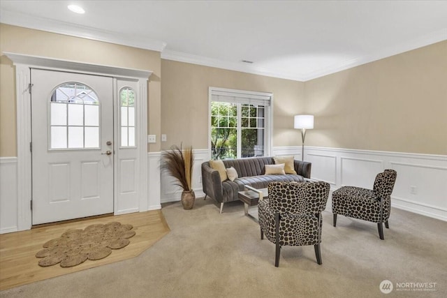 19017 5th St E, Lake Tapps, WA 98391 - carpeted foyer with ornamental molding, a wainscoted wall, and a decorative wall