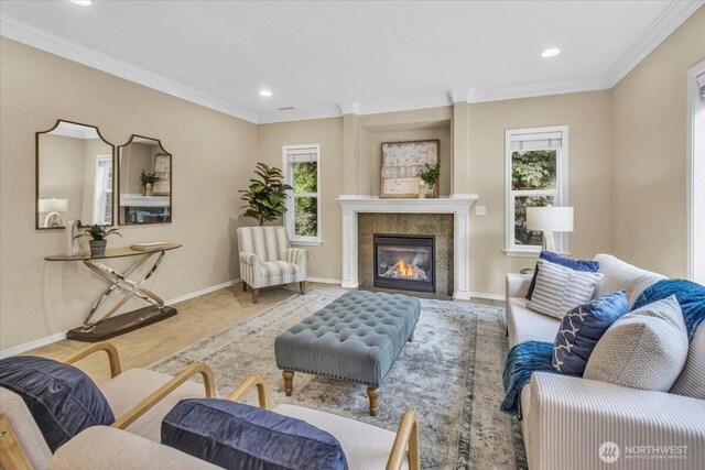 19017 5th St E, Lake Tapps, WA 98391 - living area featuring a glass covered fireplace, baseboards, recessed lighting, and crown molding