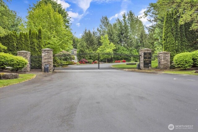19017 5th St E, Lake Tapps, WA 98391 - view of asphalt road with a gate and a gated entry