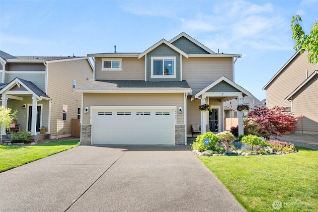 craftsman-style house with driveway, a front lawn, stone siding, and a garage