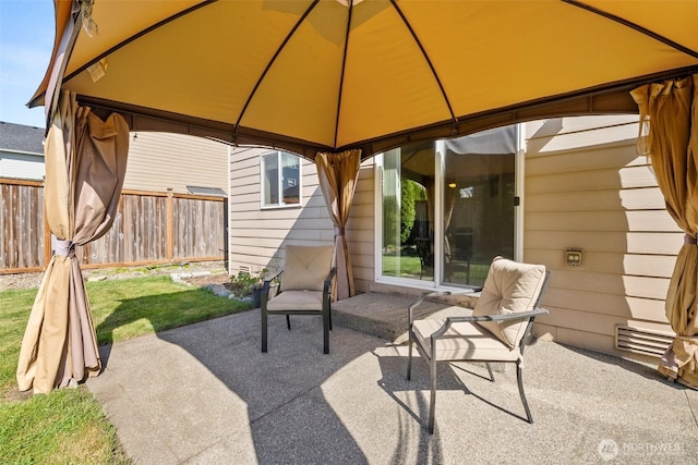 view of patio / terrace with a gazebo and fence