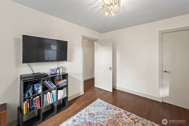 1921 N Stevens St, Tacoma, WA 98406 - bedroom with baseboards, wood finished floors, and a chandelier