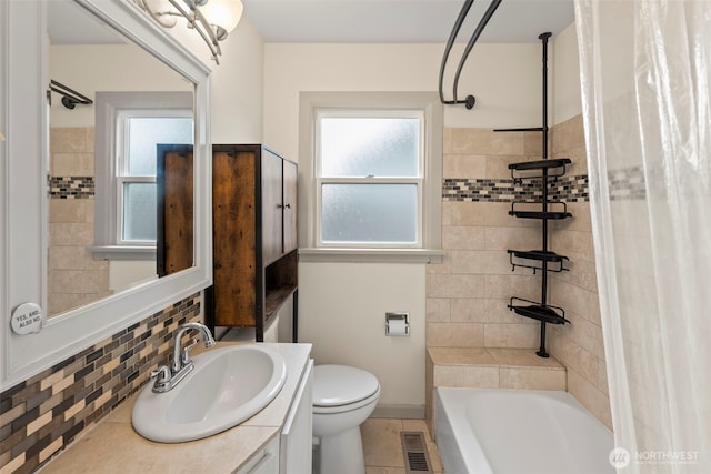 1921 N Stevens St, Tacoma, WA 98406 - bathroom featuring visible vents, decorative backsplash, vanity, toilet, and shower / tub combo