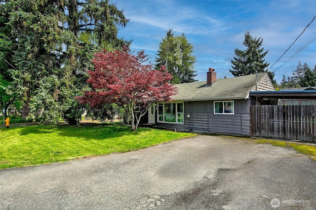12910 6th Ave S, Burien, WA 98168 - view of front of property with fence, a chimney, and a front lawn