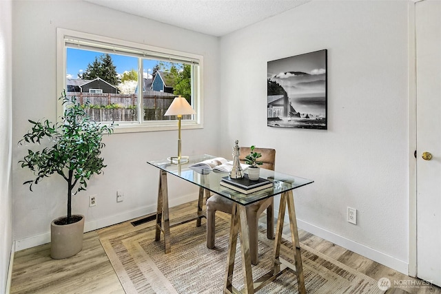 12910 6th Ave S, Burien, WA 98168 - office space with a textured ceiling, light wood finished floors, and baseboards