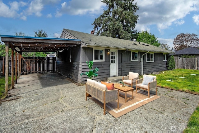 12910 6th Ave S, Burien, WA 98168 - rear view of house with outdoor lounge area, a carport, a lawn, and fence