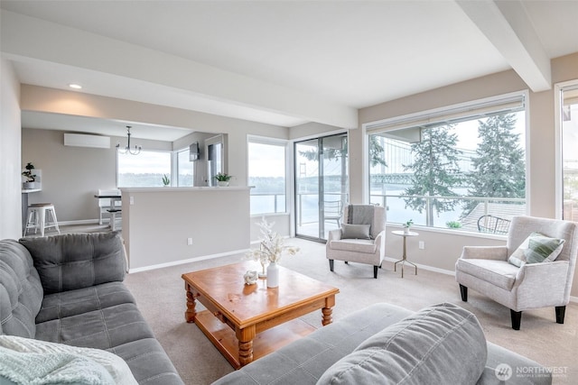 carpeted living area with beamed ceiling, baseboards, recessed lighting, an AC wall unit, and a chandelier