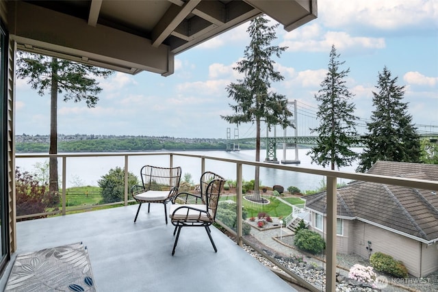 balcony featuring a water view