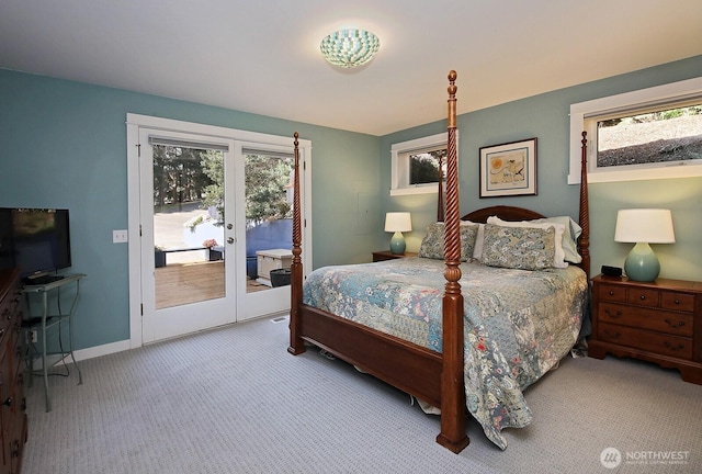 carpeted bedroom with access to outside, baseboards, and french doors
